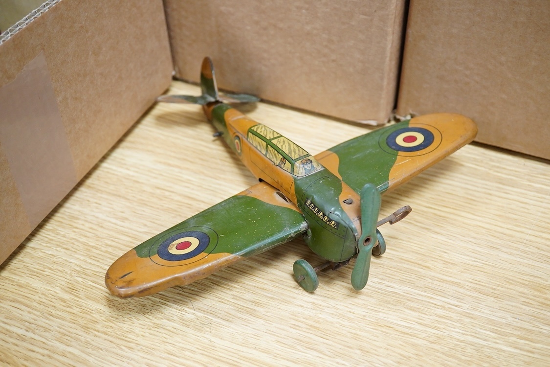 Five tinplate and diecast toys; a Wells Brimtoy tinplate London transport trolley bus, a tinplate RAF fighter aircraft possibly by Mettoy, two TTi (TT Industries) diecast Allard saloon cars, and an Arber Products diecast